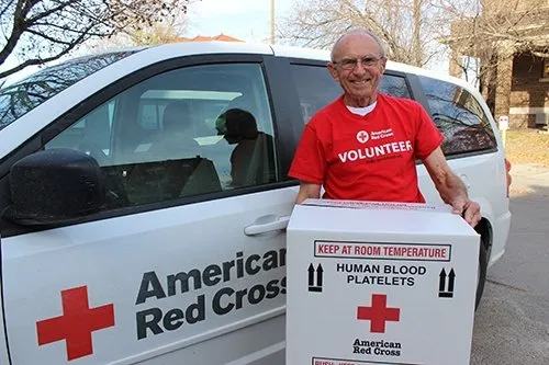 American Red Cross volunteer with a shipment of human blood platelets